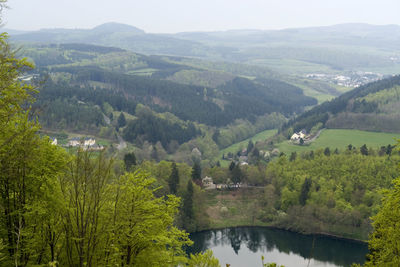 Scenic view of river amidst mountains