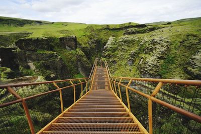 High angle view of metallic staircase over canyon