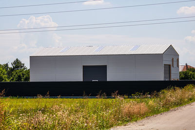 House on field against sky