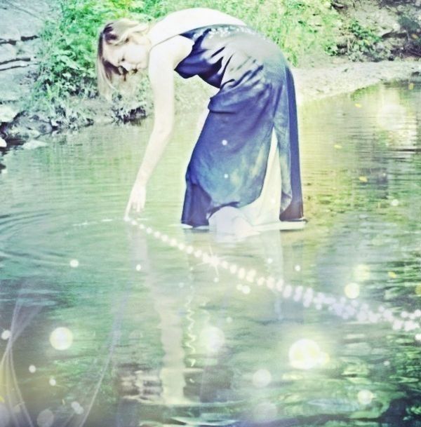 water, reflection, lake, leisure activity, waterfront, standing, lifestyles, full length, swimming, day, sunlight, outdoors, nature, rippled, young adult, three quarter length, rear view, enjoyment