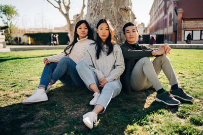 Portrait of young couple sitting outdoors