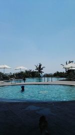 Bridge over river against clear sky