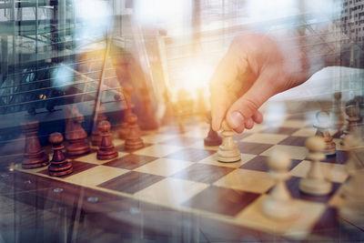 Midsection of man playing chess