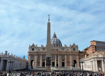 Facade of st peter's basilica against cloudy sky in rome, italy