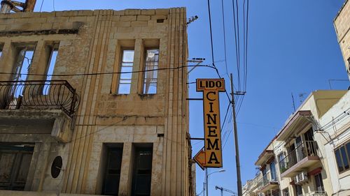 Low angle view of building against blue sky