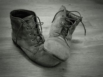 Low section of man wearing shoes