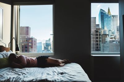Man sleeping on bed at home