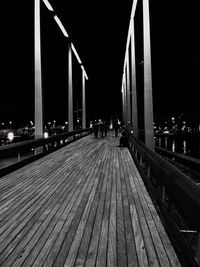 Illuminated bridge at night