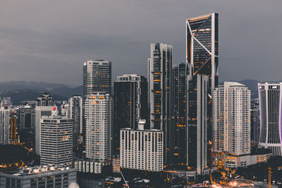 High angle view of buildings in city against sky