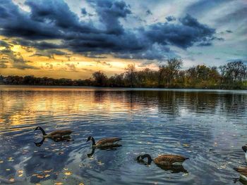 Scenic view of lake against cloudy sky