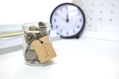 Close-up of clock on table