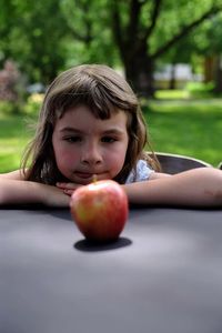 Portrait of boy with apple