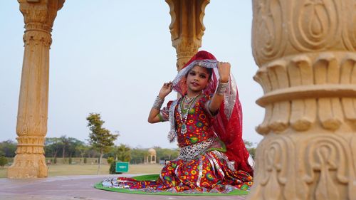 Woman sitting at temple