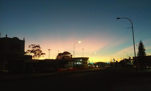 Street light against sky at dusk