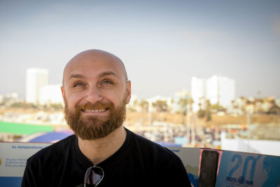 Portrait of a smiling man in city