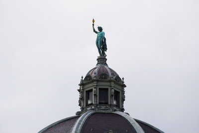 Low angle view of statue against sky