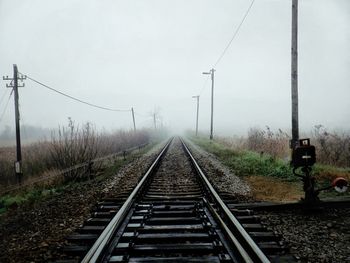 Railroad tracks in foggy weather