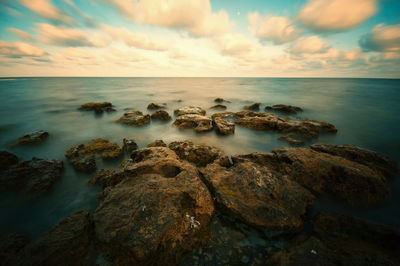 Scenic view of sea against sky during sunset