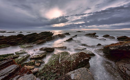 Scenic view of sea against sky during sunset