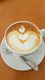 High angle view of cappuccino on table