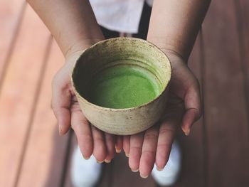 Close-up of human hand holding tea