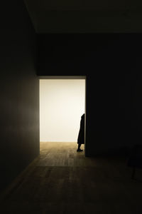 Man standing at doorway