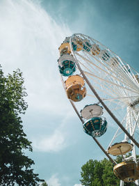 Low angle view of ferris wheel against sky