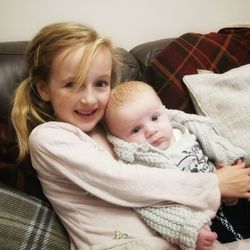 Portrait of cute baby girl at home