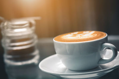 Close-up of coffee cup on table