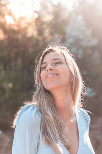 Portrait of a smiling young woman outdoors