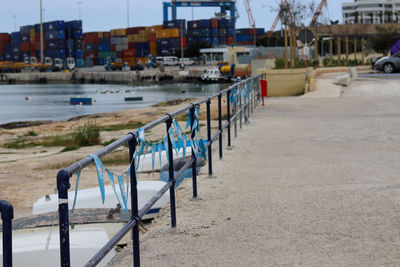 Deck chairs by canal in city