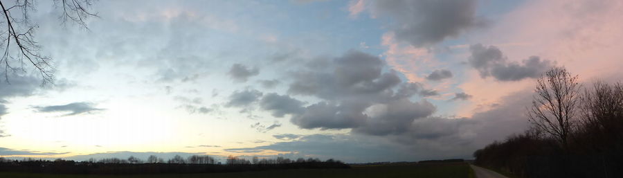 Scenic view of landscape against cloudy sky