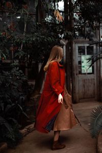 Rear view of woman with red umbrella