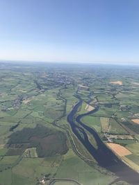 Aerial view of agricultural landscape against sky