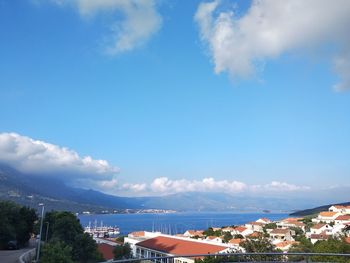 Aerial view of townscape against sky