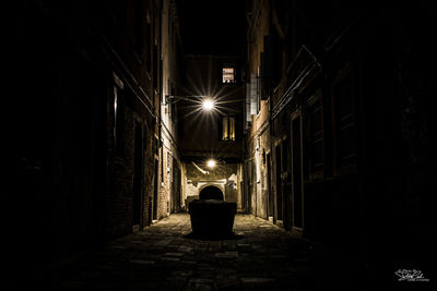 Empty illuminated street lights at night