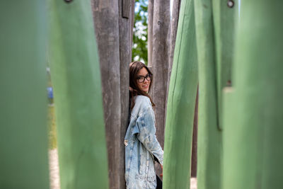 Portrait of young woman standing outdoors