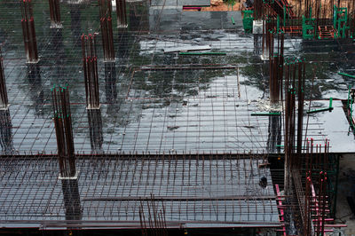 High angle view of construction site by buildings in city