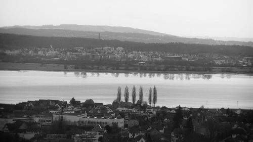 Cityscape with mountain range in background