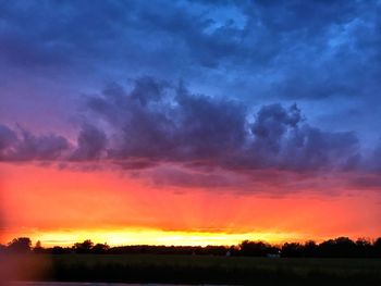 Scenic view of dramatic sky during sunset