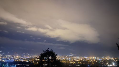 High angle view of illuminated city buildings at night