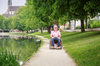 Portrait of friends sitting in park