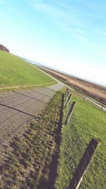 Scenic view of agricultural field against sky