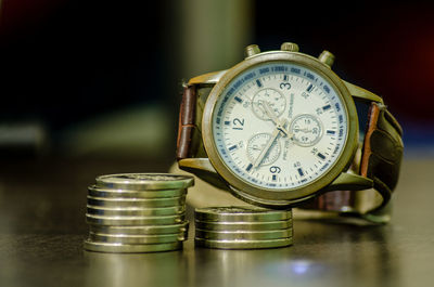 Close-up of clock on table