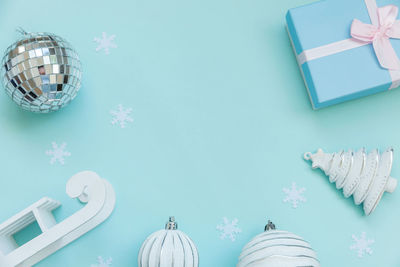 High angle view of christmas decorations on blue background