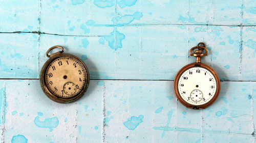 Directly above shot of old pocket watches on table