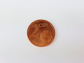 Close-up of coins on white background