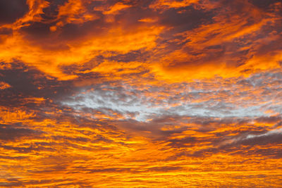 Low angle view of dramatic sky during sunset