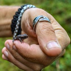 Close-up of man holding hand