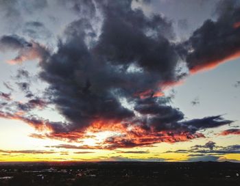 Low angle view of dramatic sky during sunset